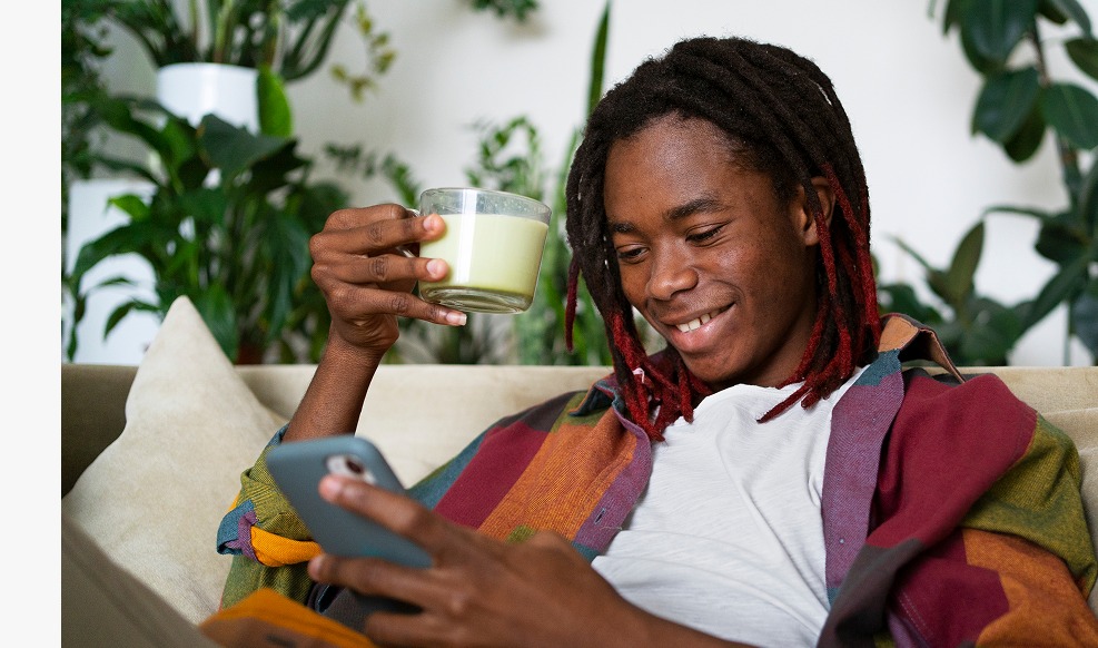 Woman reading Milestone Badge
